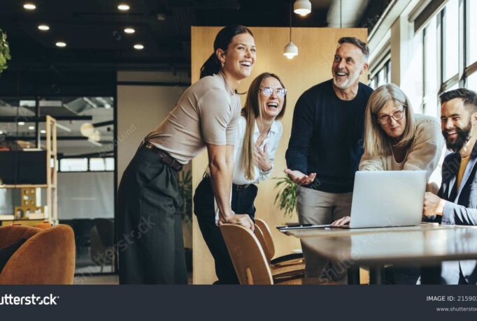 stock-photo-happy-businesspeople-laughing-while-collaborating-on-a-new-project-in-an-office-group-of-diverse-2159023891_1_11zon